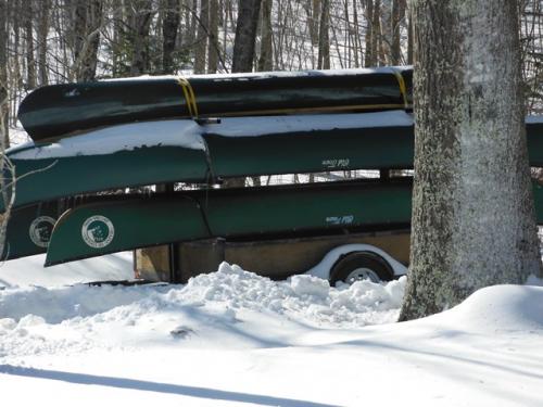 Canoes in snow waiting for spring